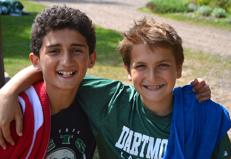 Two campers at North Star Camp for Boys smile for a picture.