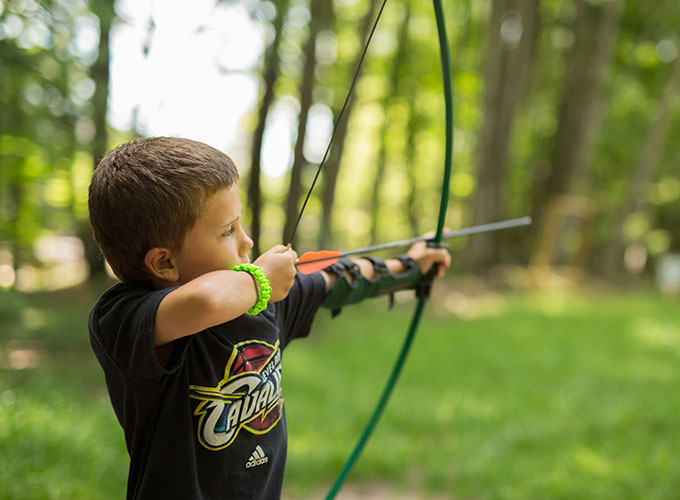 A camper gets ready to shoot an arrow during an archery activity at North Star Camp for Boys.