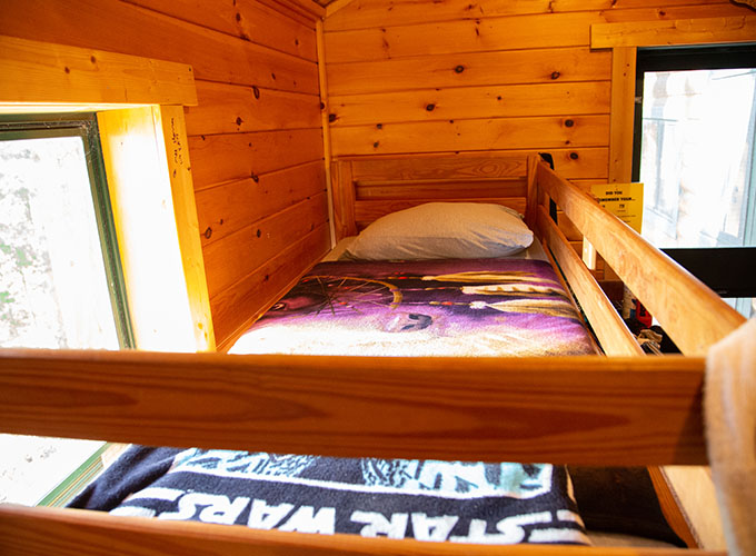 A bunk bed with a Star Wars blanket at North Star Camp for Boys.