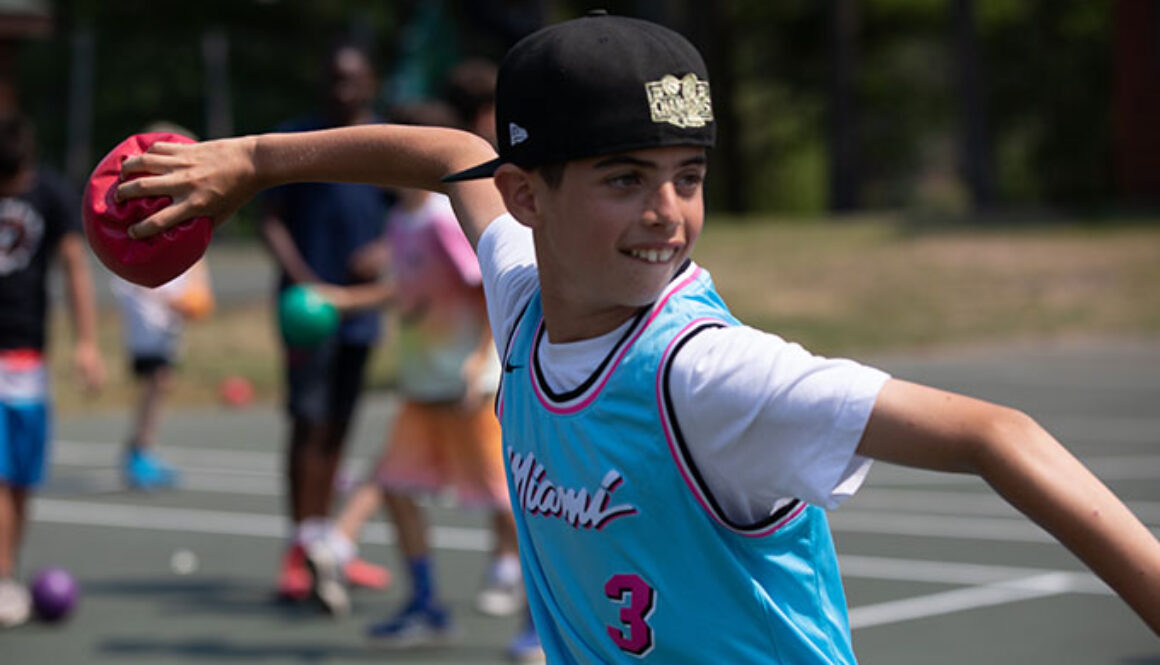 A camper gets ready to throw a ball during a game of dodgeball at North Star Camp for Boys.