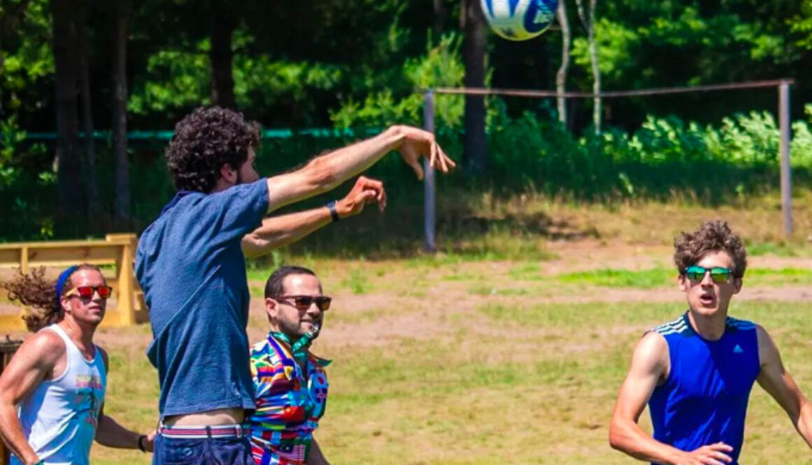 A group of staff members at North Star Camp for Boys participate in a game of speedball.
