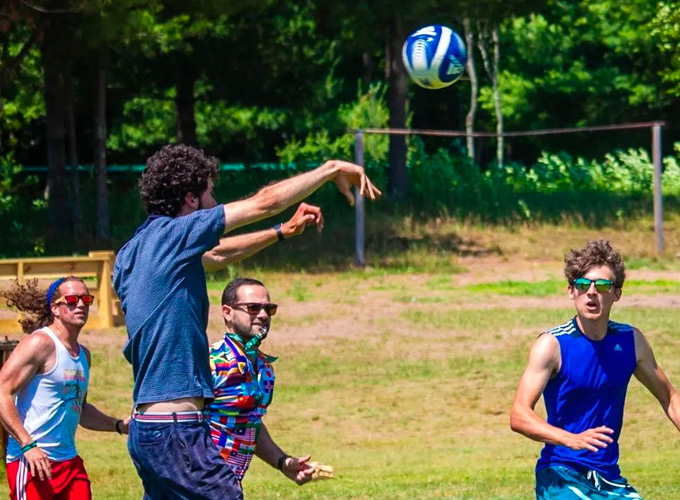 A group of staff members at North Star Camp for Boys participate in a game of speedball.