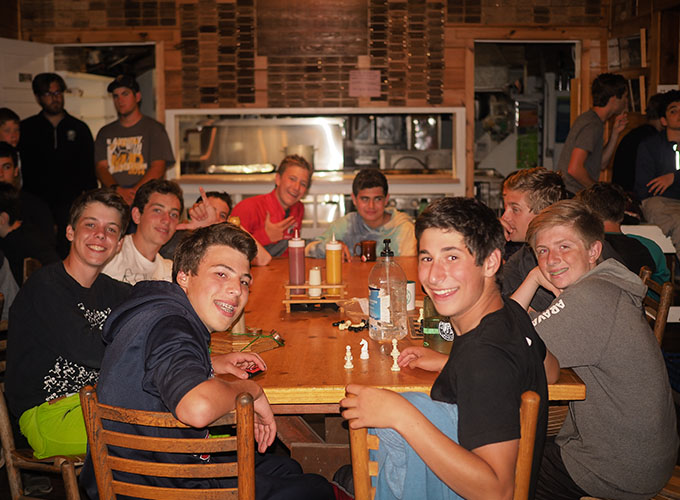 Campers smile in the cafeteria at North Star Camp for Boys.