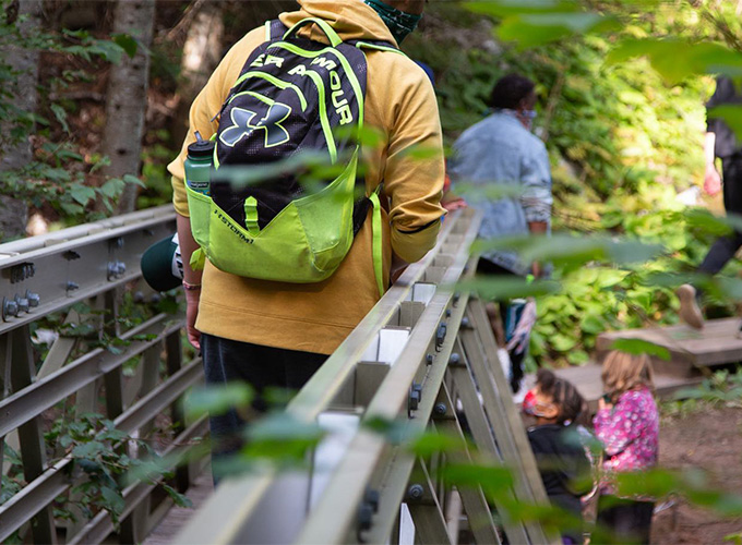 A group of campers walk through a hiking trail during a wilderness trip at North Star Camp for Boys.