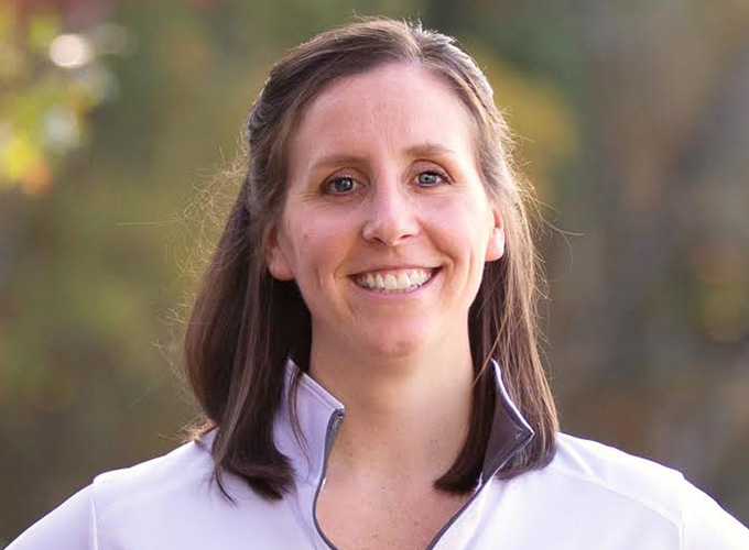 Assistant Director, Robyn Boehm, smiles for a headshot photo.