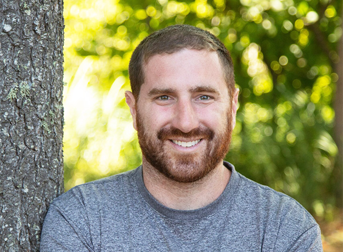 Assistant and Program Director, Brian Glickman, smiles for a photo.