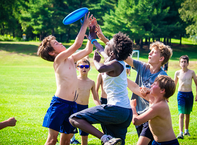 North Star Camp for Boys campers playing a competitive game of Ultimate Frisbee.