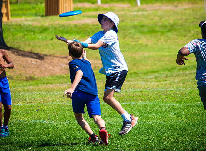 North Star Camp for Boys campers playing a competitive game of Ultimate Frisbee.