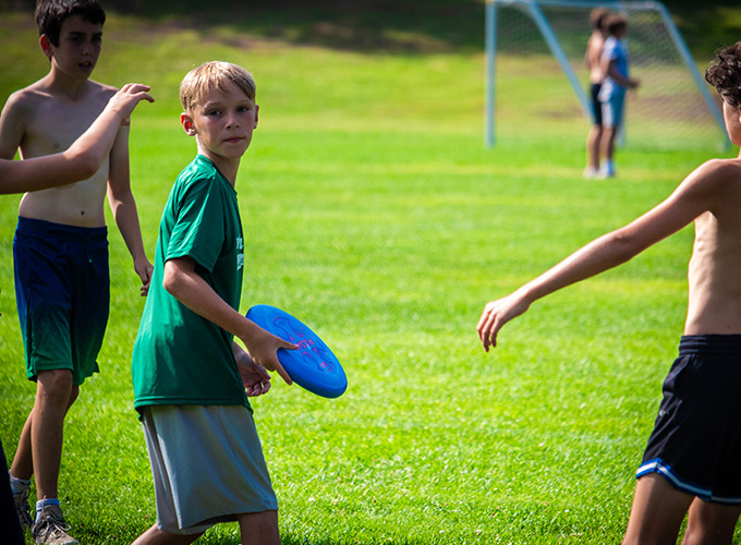 North Star Camp for Boys campers playing a competitive game of Ultimate Frisbee.
