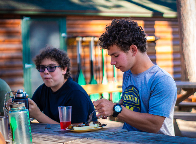 Two campers enjoy mealtime at North Star Camp for Boys.