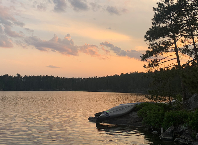 The sun setting over the lake in Quetico Provincial Park in Ontario, Canada during "The Canadian" wilderness trip at North Star Camp for Boys.
