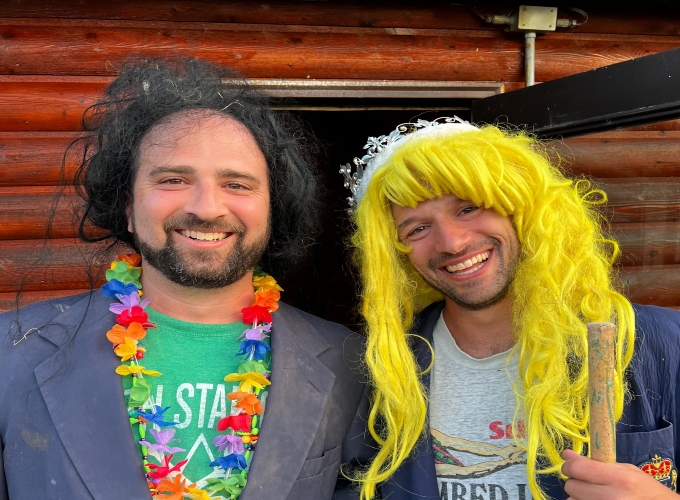 Two men dress up in costumes during for a skit show during Family Camp at North Star Camp for Boys.