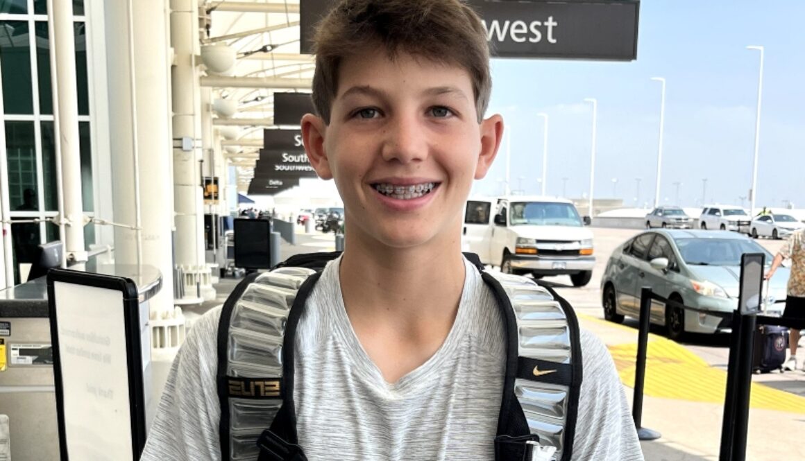 A camper gets ready to depart from the airport for a summer of fun, friends and lifelong memories at North Star Camp For Boys.