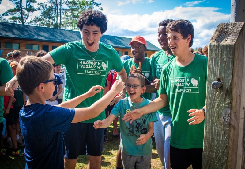 A camper meets his new cabinmates and counselors on the first day of camp at North Star Camp For Boys.