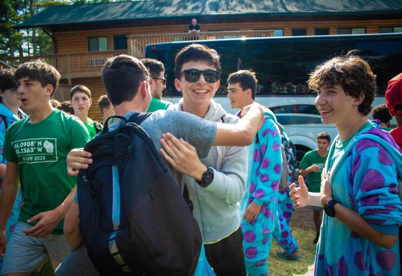 Campers and friends reunite on the first day of camp at North Star Camp For Boys.