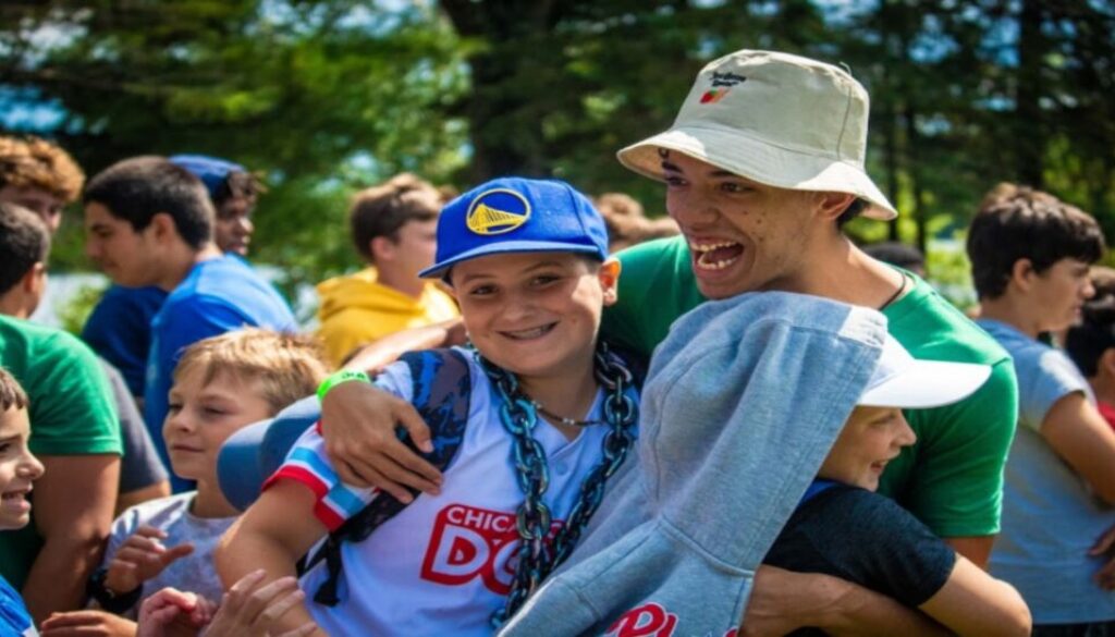 A counselor reunites with his former campers on the first day of camp at North Star Camp For Boys.
