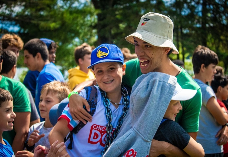 A counselor reunites with his former campers on the first day of camp at North Star Camp For Boys.