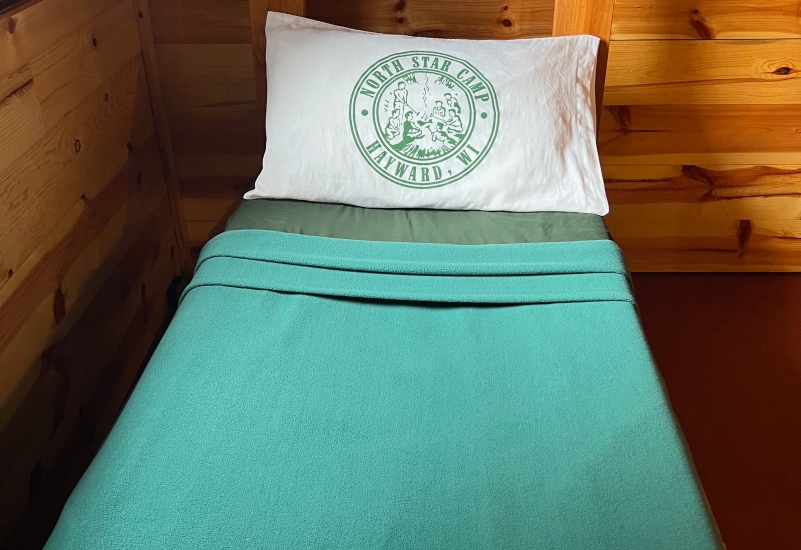 North Star Camp bedding available for campers via the camp Bedding & Towel service.