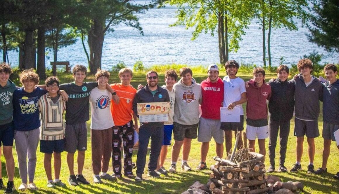 A group of North Star Camp Counselors-in-Training take a group picture with the CIT DIrector after a successful summer at camp.
