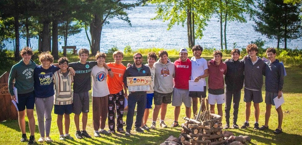 A group of North Star Camp Counselors-in-Training take a group picture with the CIT DIrector after a successful summer at camp.