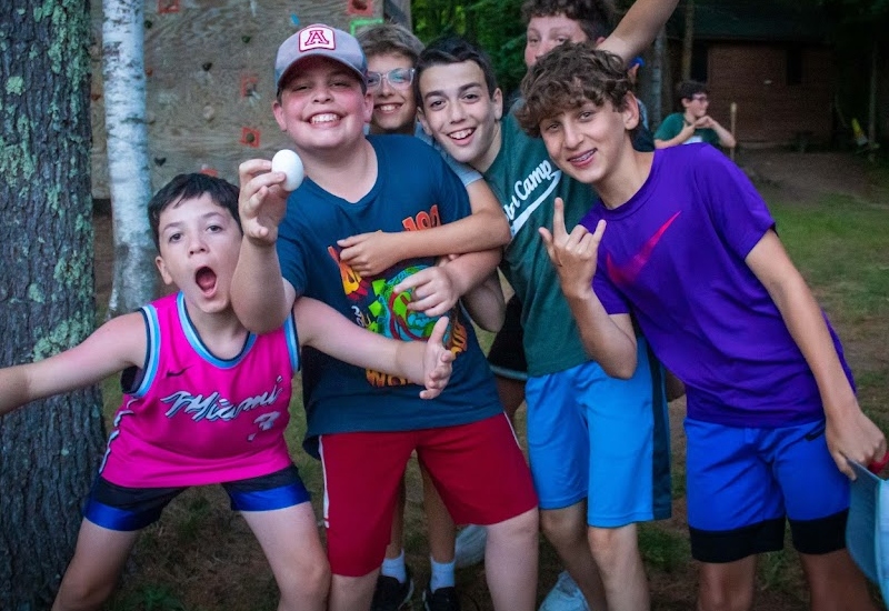 A group of North Star Camp campers smile as they are having fun during a special event.