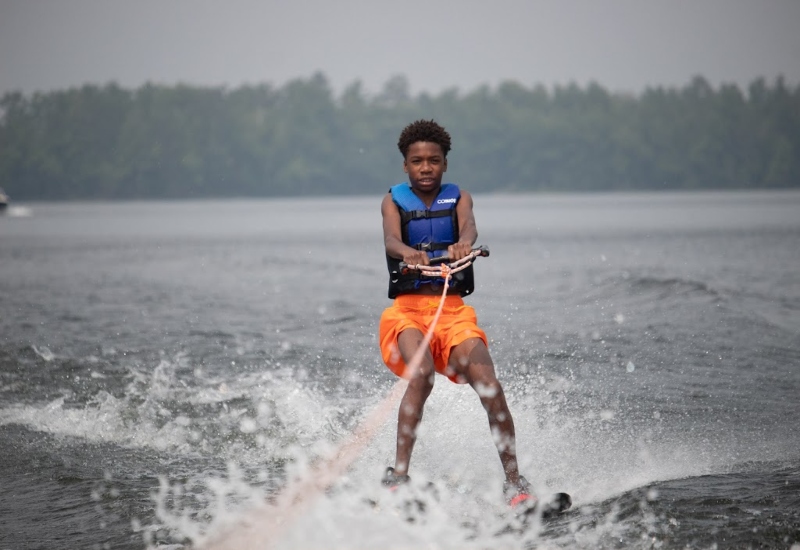 A North Star Camp camper goes waterskiing on Spider Lake.