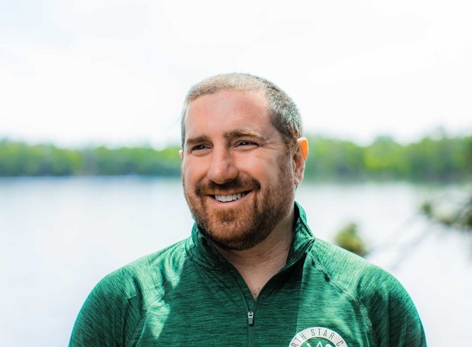 Assistant and Program Director, Brian Glickman, smiles for a headshot photo.