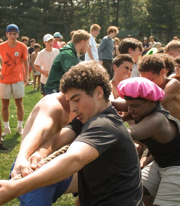 Campers pull hard during a tug of war competition.