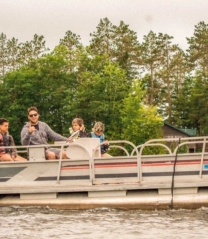 Campers ride the pontoon boat on Spider Lake.