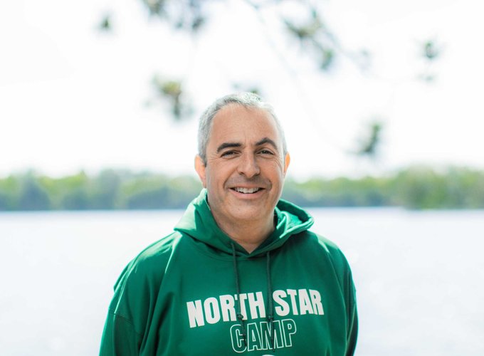 Director of Operations, Dan Lichtenstein, smiles for a headshot photo.